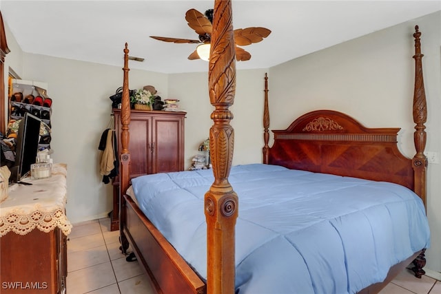 bedroom with ceiling fan and light tile patterned flooring