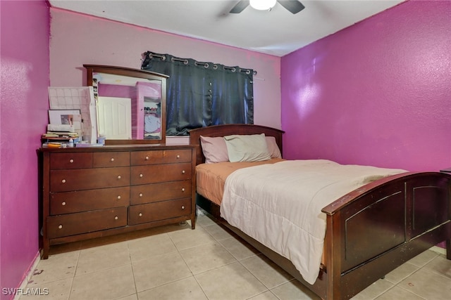 bedroom featuring a ceiling fan and light tile patterned floors