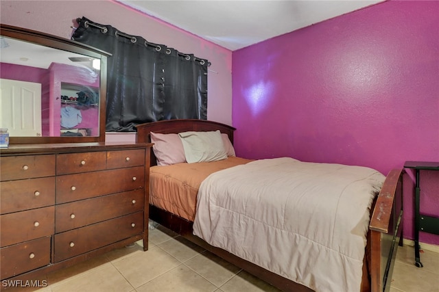 bedroom with light tile patterned flooring