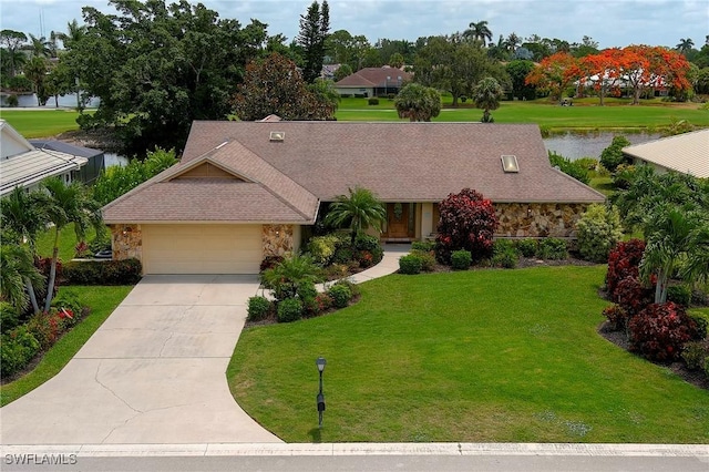 view of front facade featuring an attached garage, stone siding, concrete driveway, and a front yard