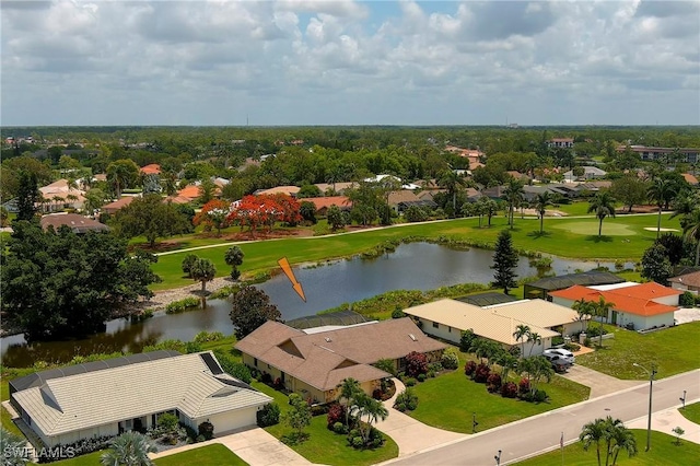 birds eye view of property featuring a water view and a residential view