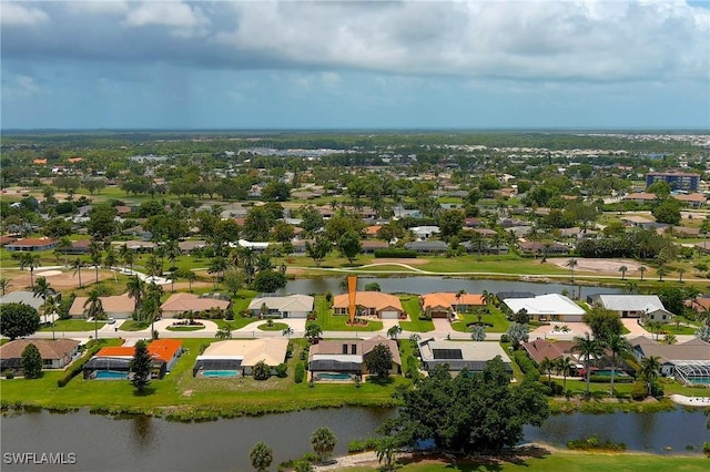 birds eye view of property with a water view and a residential view