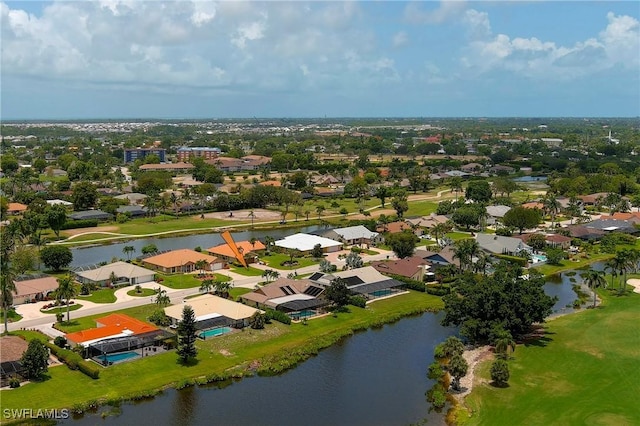 drone / aerial view with a water view and a residential view