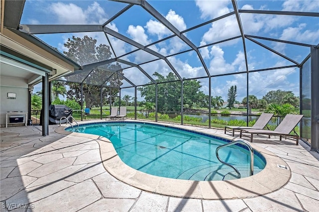 outdoor pool with a patio, a water view, and a lanai