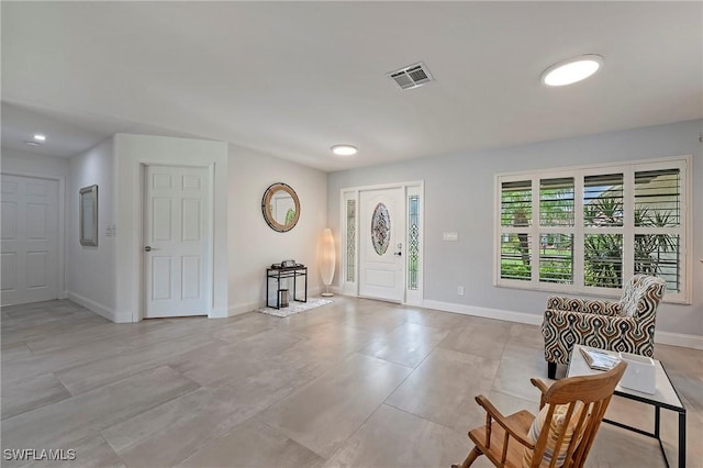 entrance foyer featuring baseboards and visible vents