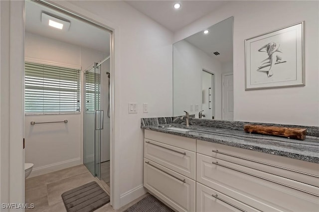 full bath featuring visible vents, toilet, vanity, a shower stall, and recessed lighting