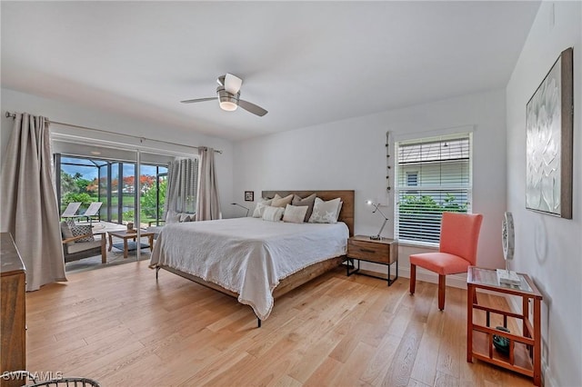 bedroom with a ceiling fan, light wood-style flooring, and access to exterior