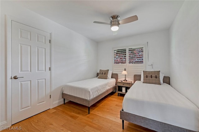 bedroom with ceiling fan and light wood-type flooring