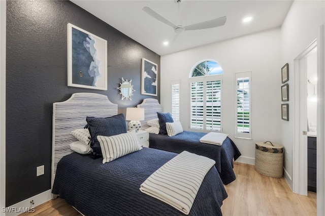 bedroom with light wood-type flooring, ceiling fan, baseboards, and recessed lighting