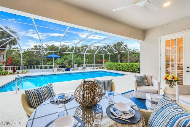 view of pool with a fenced in pool, a patio, ceiling fan, a lanai, and outdoor lounge area