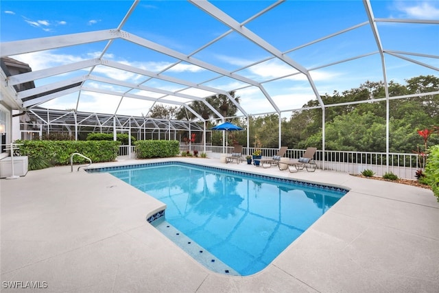 outdoor pool featuring a lanai and a patio