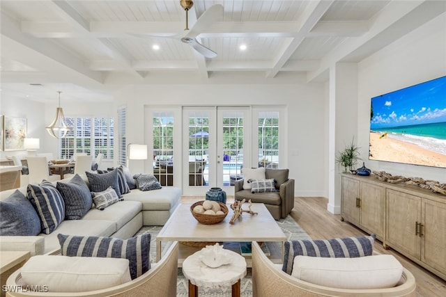 living room featuring light wood-style floors, coffered ceiling, and beamed ceiling