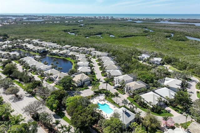 aerial view with a residential view and a water view