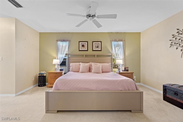 bedroom featuring a ceiling fan, carpet, visible vents, and baseboards