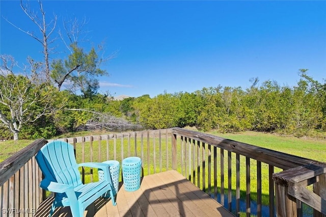 wooden deck with a yard