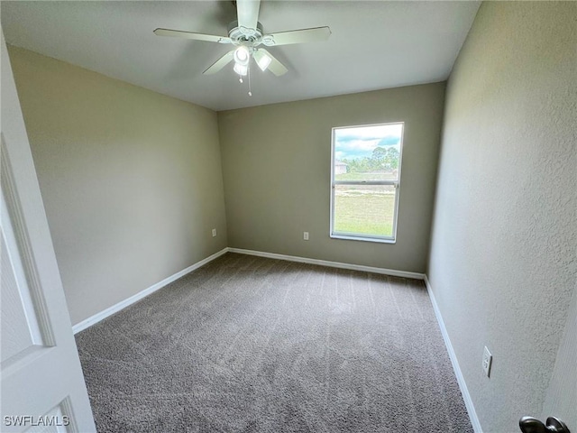 unfurnished room featuring ceiling fan, carpet, and baseboards