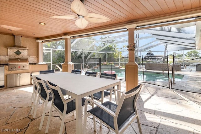 sunroom with ceiling fan and wood ceiling