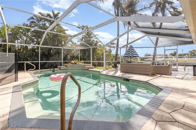 outdoor pool featuring a lanai, an outdoor living space, and a patio