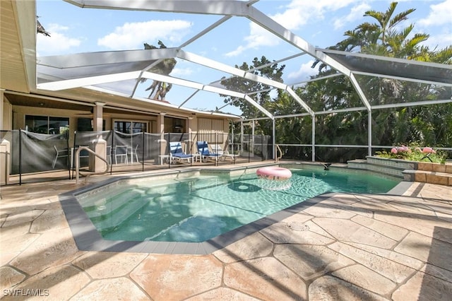 view of pool featuring a lanai, a patio area, and a fenced in pool