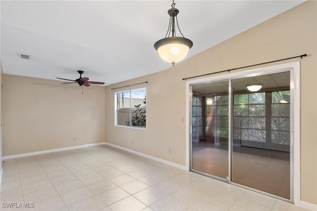 unfurnished room with light tile patterned floors, visible vents, baseboards, and ceiling fan