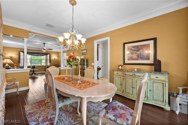 dining area with baseboards, visible vents, ornamental molding, dark wood-type flooring, and ceiling fan with notable chandelier