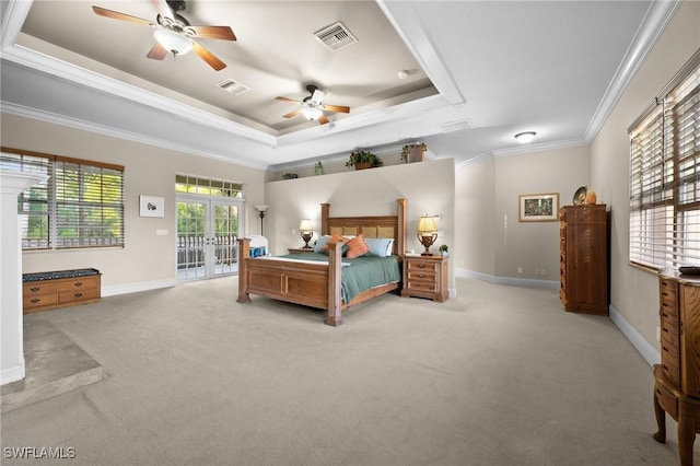 bedroom with access to exterior, crown molding, a raised ceiling, visible vents, and baseboards