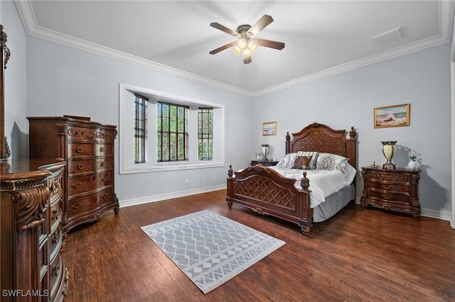 bedroom featuring ornamental molding, dark wood-type flooring, visible vents, and baseboards