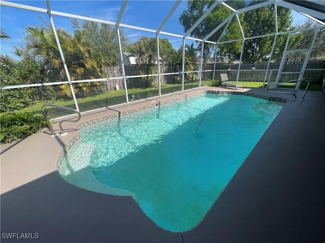 view of pool with a fenced in pool, a lanai, and a fenced backyard