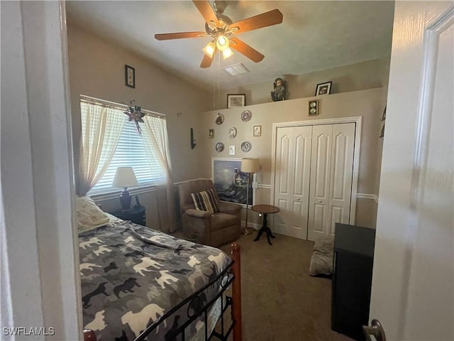 bedroom with carpet floors, a closet, visible vents, a ceiling fan, and vaulted ceiling