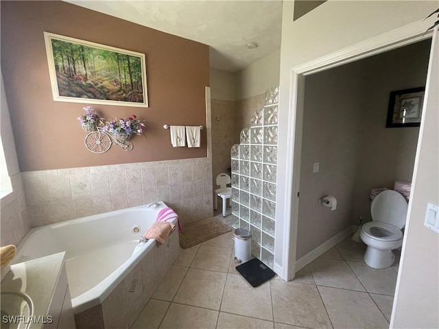 full bath with toilet, a garden tub, tile patterned flooring, and walk in shower