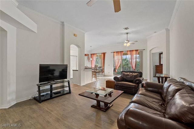 living room featuring visible vents, a ceiling fan, ornamental molding, wood finished floors, and baseboards