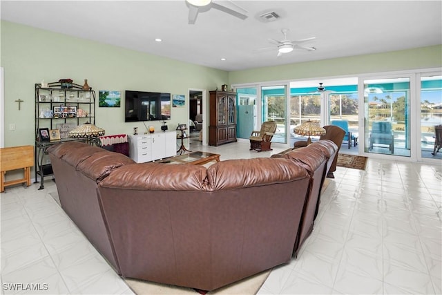 living area with light floors, ceiling fan, visible vents, and recessed lighting