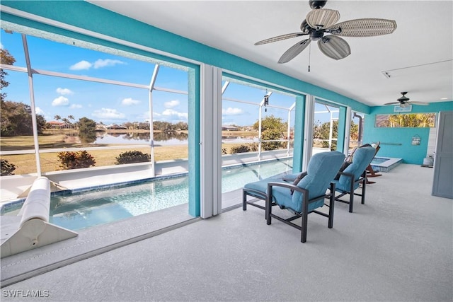 unfurnished sunroom with a ceiling fan