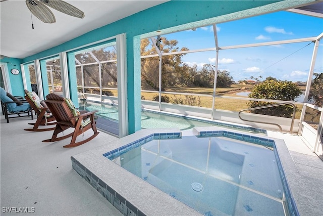 pool with a lanai, ceiling fan, and a patio