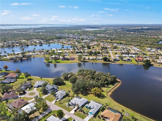 bird's eye view featuring a water view and a residential view