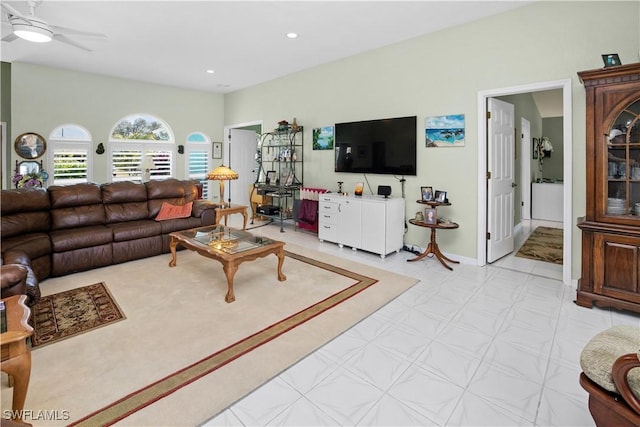 living area featuring light floors, ceiling fan, baseboards, and recessed lighting