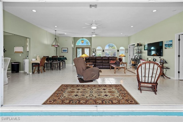 living room featuring ceiling fan, visible vents, baseboards, and recessed lighting