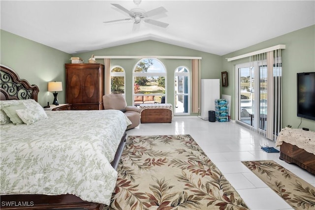 bedroom featuring lofted ceiling, light tile patterned floors, a ceiling fan, and access to exterior