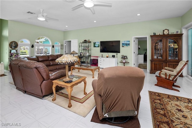 living area featuring ceiling fan, visible vents, and recessed lighting