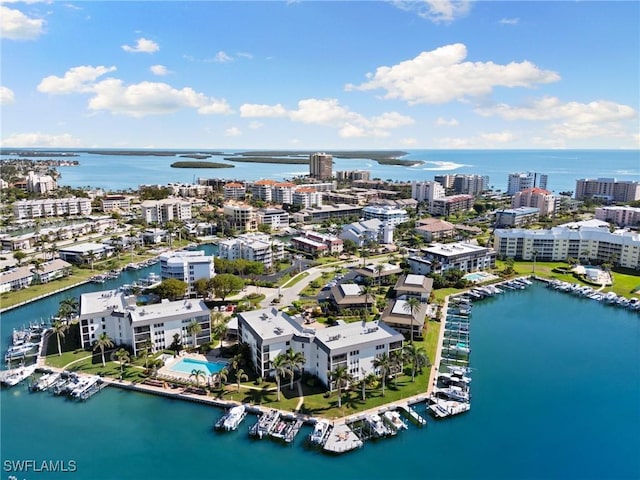 birds eye view of property featuring a view of city and a water view