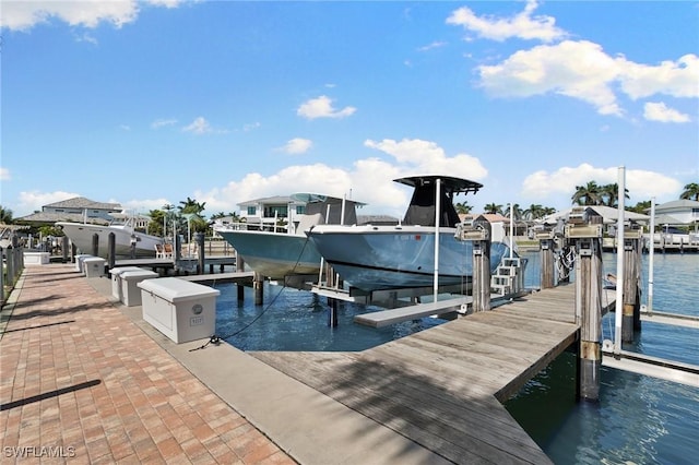 880 Huron Ct Unit 107, Marco Island, FL 34145 - dock featuring boat lift and a water view