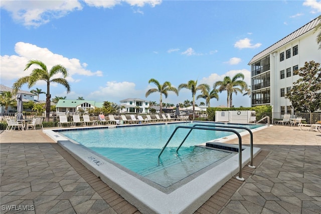 880 Huron Ct Unit 107, Marco Island, FL 34145 - community pool with a patio and fence