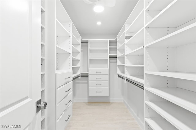 880 Huron Ct Unit 107, Marco Island, FL 34145 - walk in closet featuring light wood finished floors