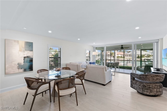 880 Huron Ct Unit 107, Marco Island, FL 34145 - dining space with recessed lighting, light wood-style floors, a wall of windows, and ceiling fan