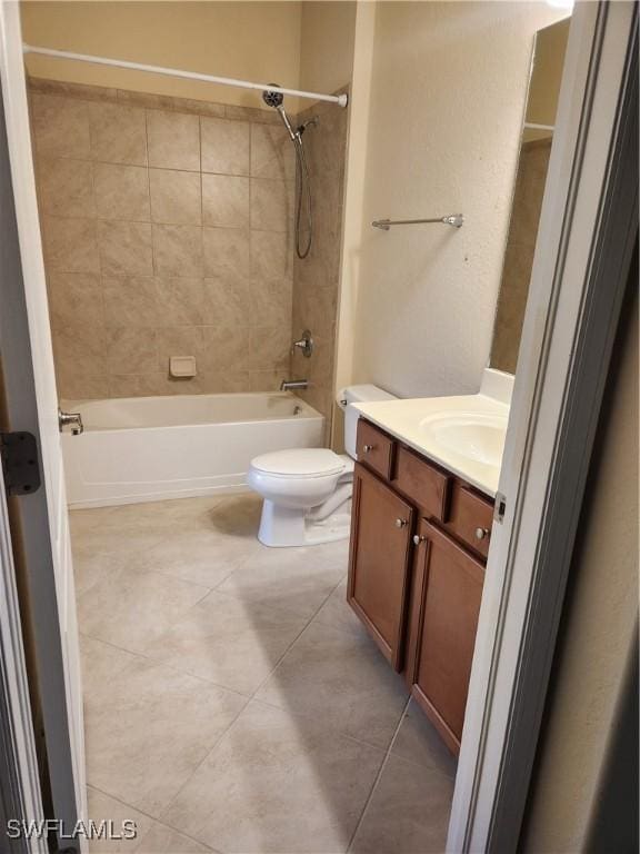 bathroom with tile patterned floors, vanity, toilet, and bathing tub / shower combination