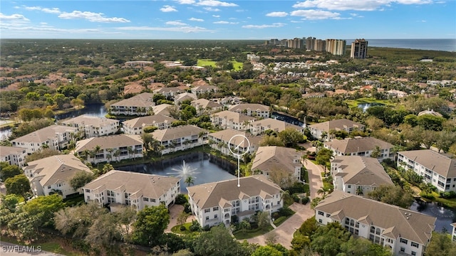 bird's eye view with a water view and a residential view