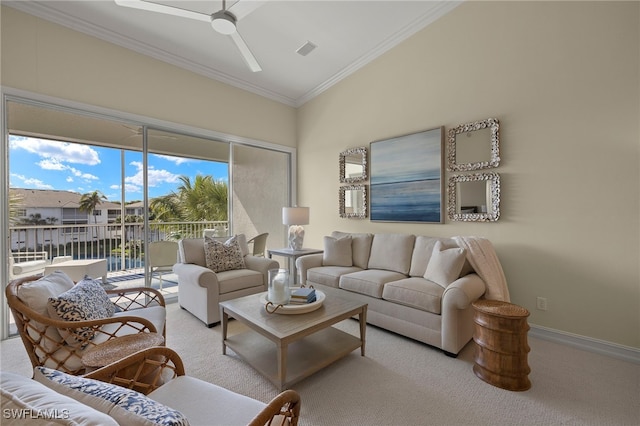 living room with light carpet, baseboards, visible vents, a ceiling fan, and crown molding