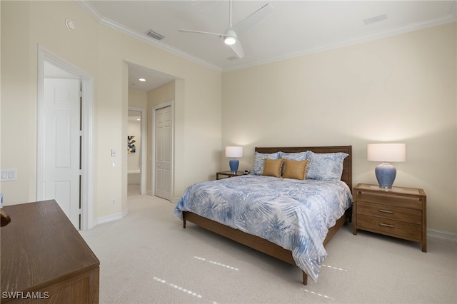 bedroom featuring light colored carpet, crown molding, visible vents, and baseboards