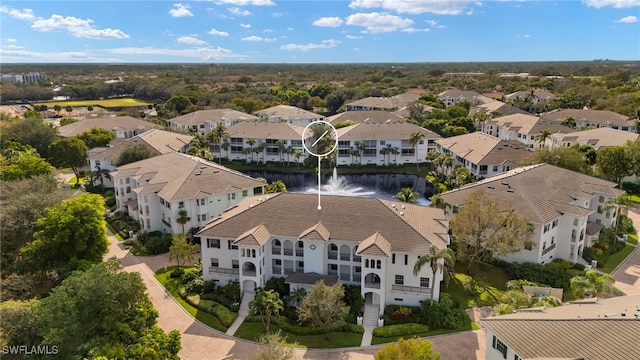 birds eye view of property with a residential view