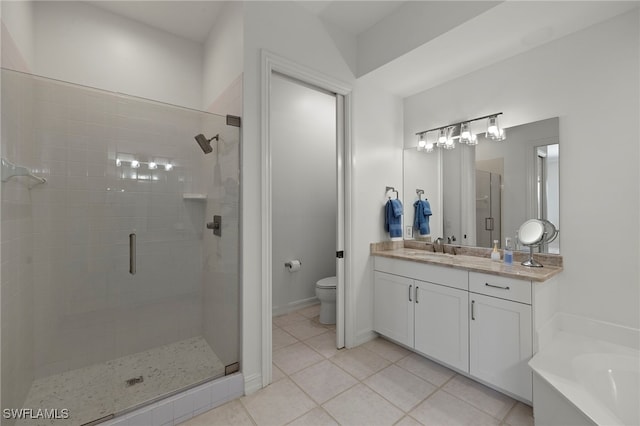 full bath featuring toilet, tile patterned flooring, vanity, a shower stall, and a bath